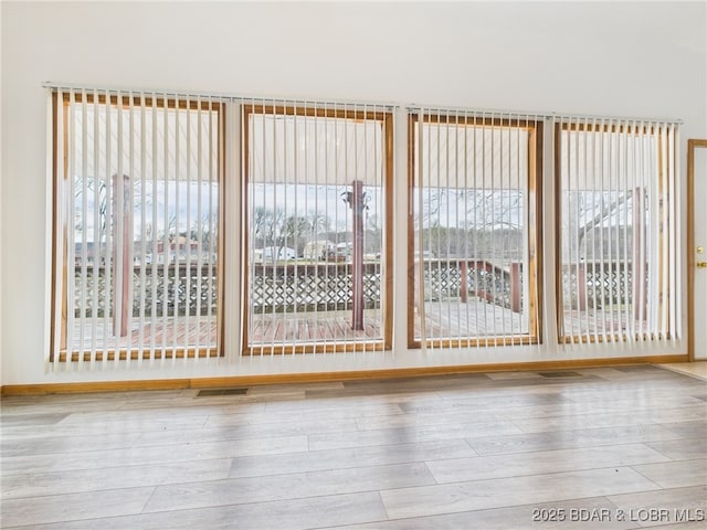3760 Dogwood Dr, Stover, MO 65078 - interior space featuring a wealth of natural light, baseboards, and hardwood / wood-style flooring