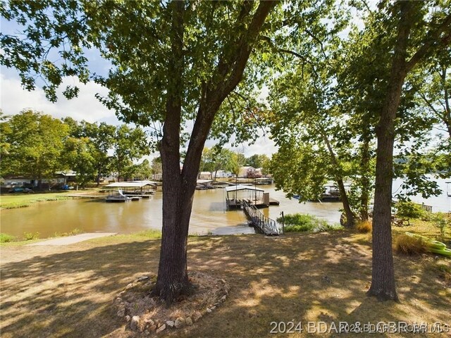 3760 Dogwood Dr, Stover, MO 65078 - view of yard featuring a water view and a boat dock