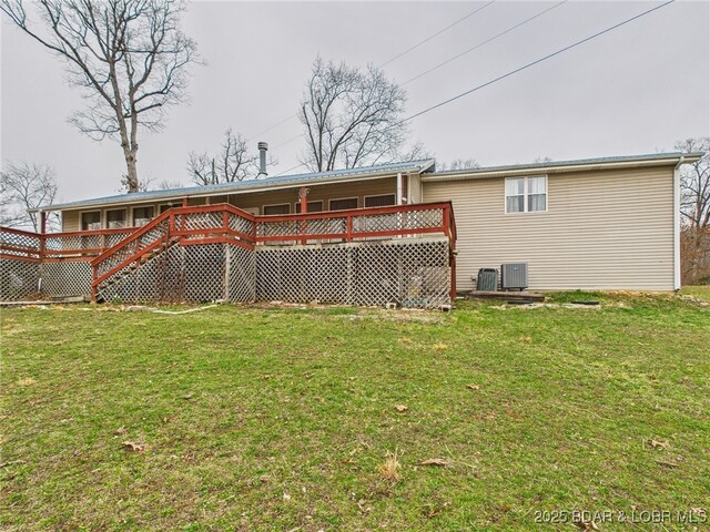 3760 Dogwood Dr, Stover, MO 65078 - rear view of house featuring a lawn, central air condition unit, and a wooden deck