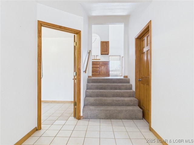 3760 Dogwood Dr, Stover, MO 65078 - stairway with baseboards and tile patterned flooring