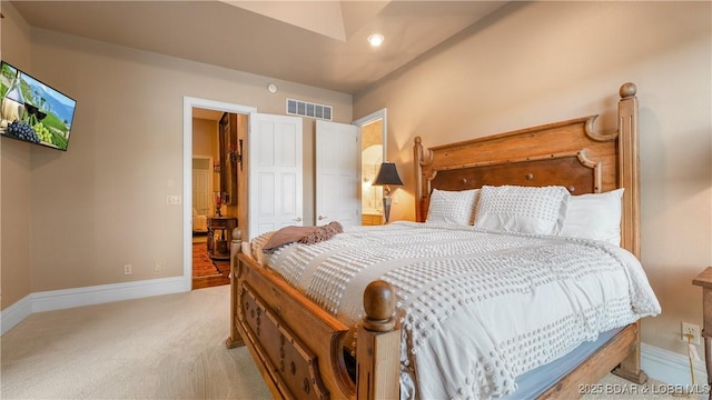 bedroom featuring baseboards, visible vents, and carpet flooring