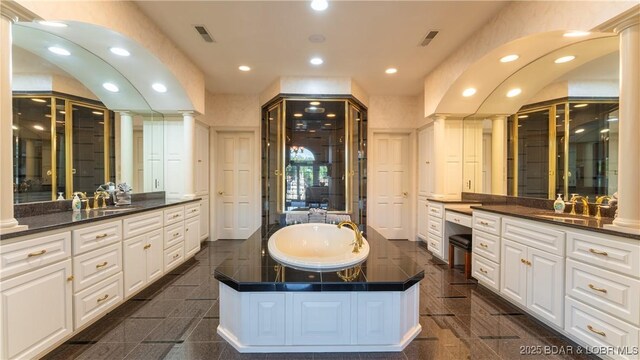 full bath with ornate columns, visible vents, granite finish floor, and recessed lighting