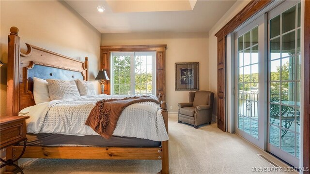 carpeted bedroom with access to exterior