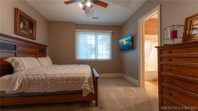 bedroom featuring baseboards, carpet floors, connected bathroom, and visible vents