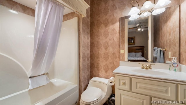 full bathroom with ensuite bathroom, toilet, wallpapered walls, vanity, and shower / tub combo with curtain