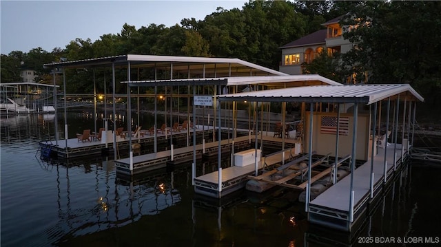view of dock with a water view and boat lift