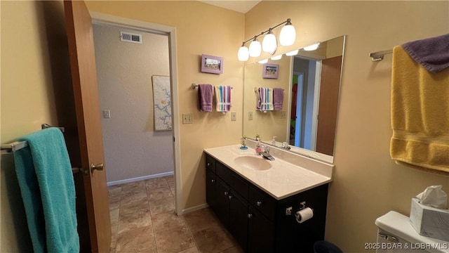 31347 Northshore Dr Unit 101A, Rocky Mount, MO 65072 - bathroom with baseboards, visible vents, toilet, and vanity