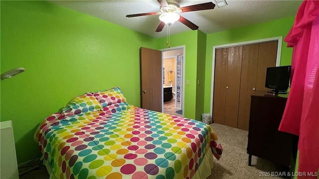 31347 Northshore Dr Unit 101A, Rocky Mount, MO 65072 - carpeted bedroom featuring a closet, a textured ceiling, visible vents, and ceiling fan