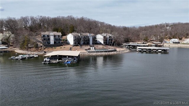 31347 Northshore Dr Unit 101A, Rocky Mount, MO 65072 - property view of water featuring a floating dock and a view of trees