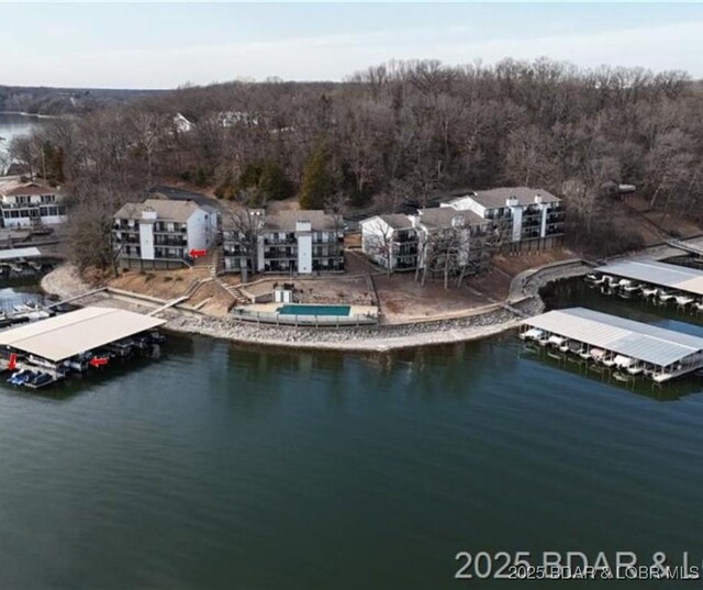 31347 Northshore Dr Unit 101A, Rocky Mount, MO 65072 - drone / aerial view featuring a water view and a view of trees
