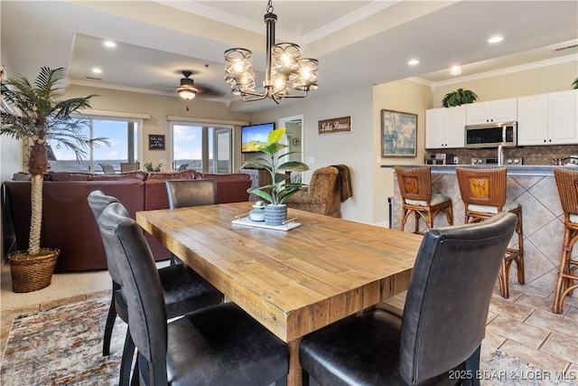 dining space with ornamental molding, a chandelier, recessed lighting, and a ceiling fan