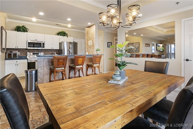 dining room featuring crown molding, a chandelier, and recessed lighting