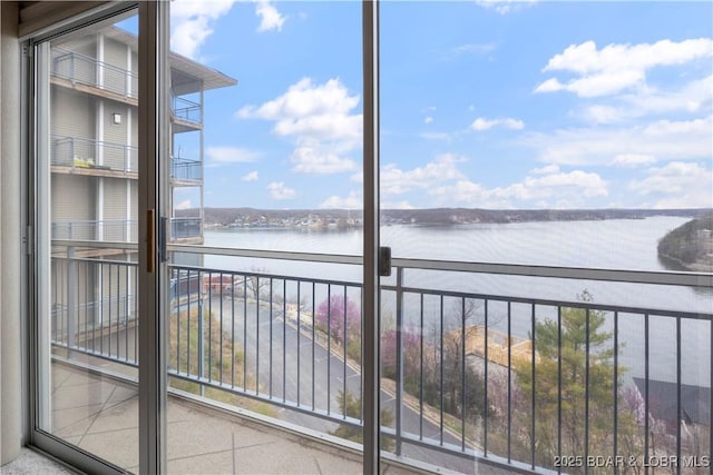 balcony featuring a water view