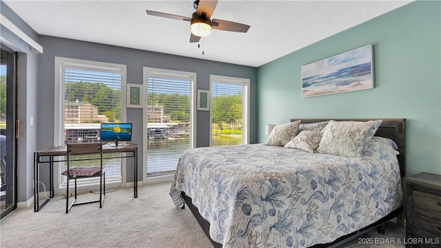 123 Southwood Shores Dr Unit 2B, Lake Ozark, MO 65049 - carpeted bedroom with a textured ceiling and ceiling fan