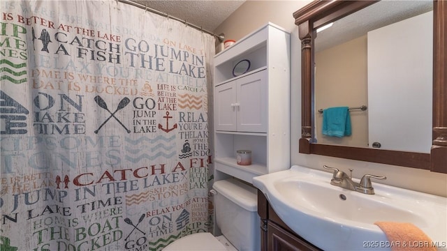 123 Southwood Shores Dr Unit 2B, Lake Ozark, MO 65049 - full bathroom with vanity, a textured ceiling, and curtained shower
