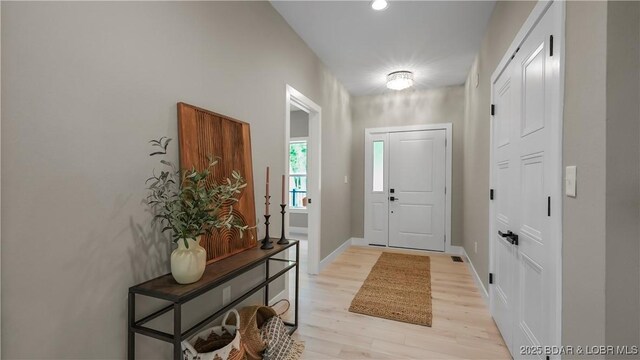 20311 Timberlake Village Ln, Rocky Mount, MO 65072 - foyer entrance with light wood finished floors and baseboards
