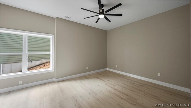 20311 Timberlake Village Ln, Rocky Mount, MO 65072 - spare room with baseboards, visible vents, a ceiling fan, and light wood finished floors