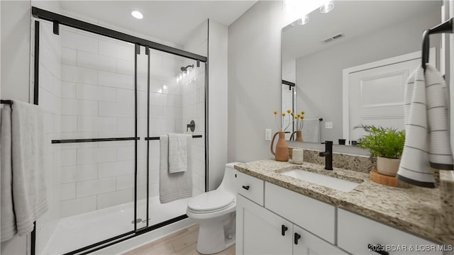 20311 Timberlake Village Ln, Rocky Mount, MO 65072 - bathroom with visible vents, a stall shower, toilet, and vanity
