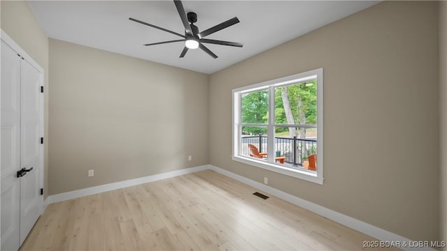 20311 Timberlake Village Ln, Rocky Mount, MO 65072 - unfurnished room with baseboards, visible vents, a ceiling fan, and wood finished floors
