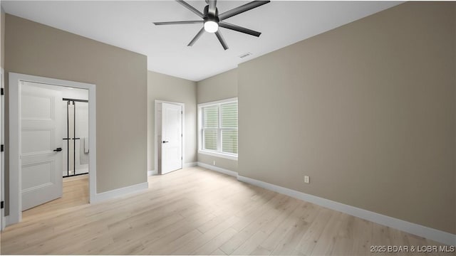 20311 Timberlake Village Ln, Rocky Mount, MO 65072 - unfurnished bedroom with baseboards, ceiling fan, visible vents, and light wood-style floors