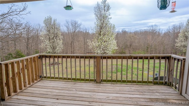 deck featuring a view of trees