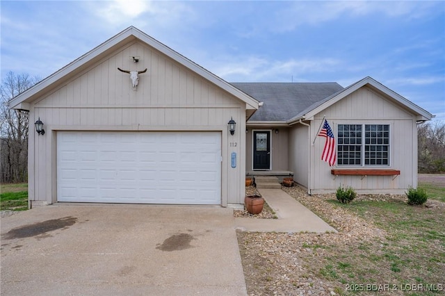 ranch-style home with driveway and a garage