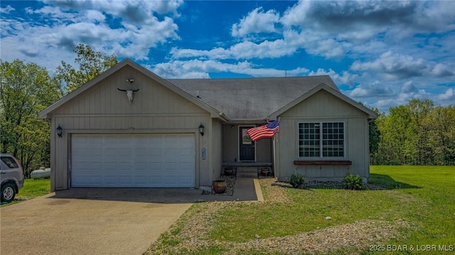 ranch-style home featuring a front yard, driveway, and a garage