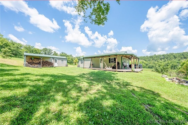 view of yard featuring a wooden deck