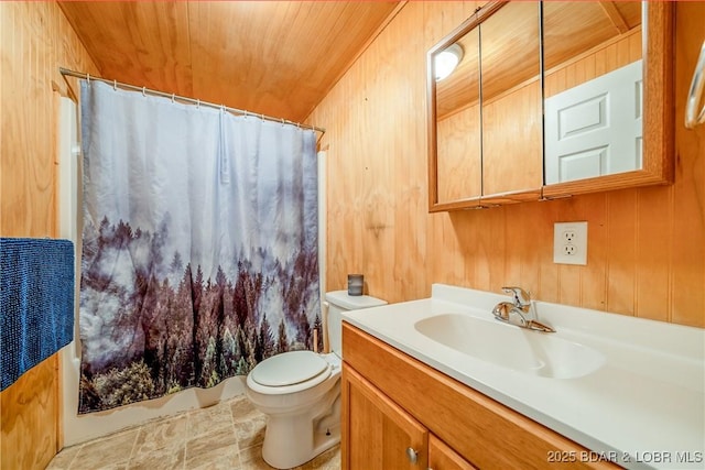 full bath featuring vanity, shower / tub combo with curtain, toilet, wooden ceiling, and wooden walls