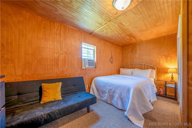 carpeted bedroom featuring cooling unit, wood walls, and wood ceiling