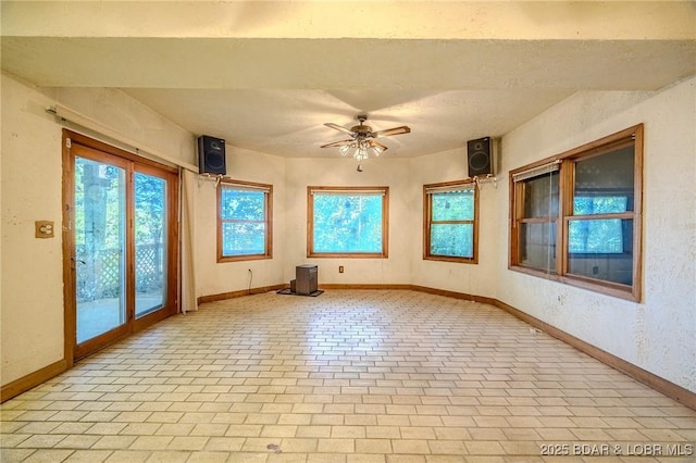 27394 Cross Ln, Barnett, MO 65011 - spare room with baseboards and a ceiling fan