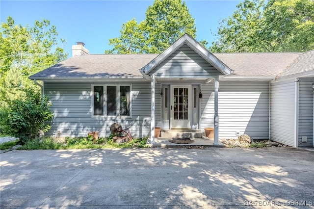 27394 Cross Ln, Barnett, MO 65011 - view of front of house featuring a chimney and a shingled roof