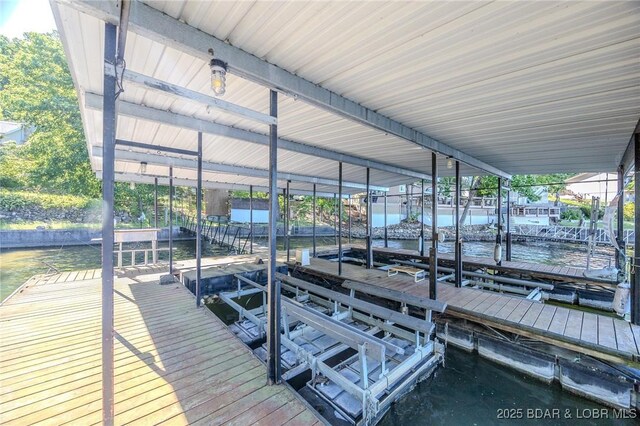 27394 Cross Ln, Barnett, MO 65011 - dock area with boat lift and a water view