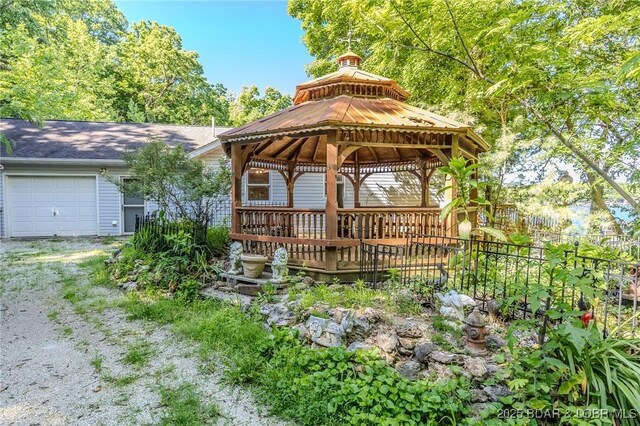 27394 Cross Ln, Barnett, MO 65011 - view of front facade with a gazebo, an attached garage, and driveway