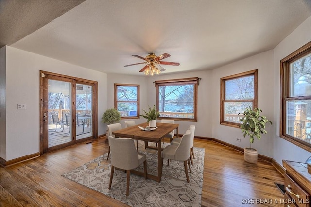 27394 Cross Ln, Barnett, MO 65011 - dining room with healthy amount of natural light, wood finished floors, and a ceiling fan
