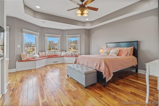 bedroom with light wood-type flooring, baseboards, recessed lighting, and ceiling fan