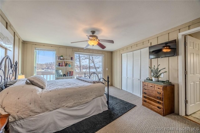 33271 Elaine Rd, Sunrise Beach, MO 65079 - bedroom with carpet floors, ceiling fan, and a closet