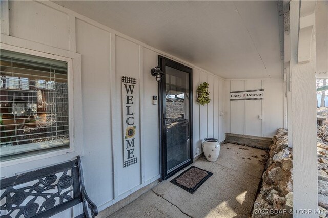 33271 Elaine Rd, Sunrise Beach, MO 65079 - view of exterior entry featuring covered porch