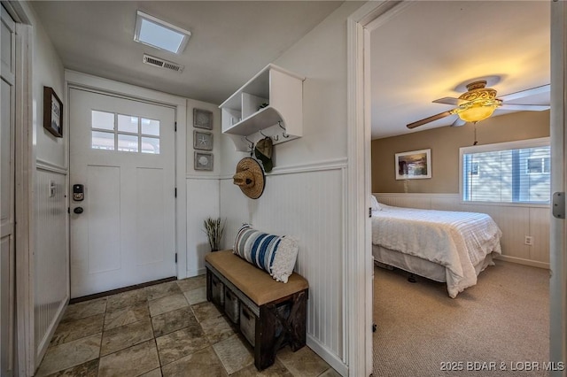 33271 Elaine Rd, Sunrise Beach, MO 65079 - mudroom with ceiling fan, healthy amount of natural light, and a wainscoted wall