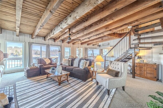 33271 Elaine Rd, Sunrise Beach, MO 65079 - carpeted living room with stairs, ceiling fan, and wood ceiling with exposed beams