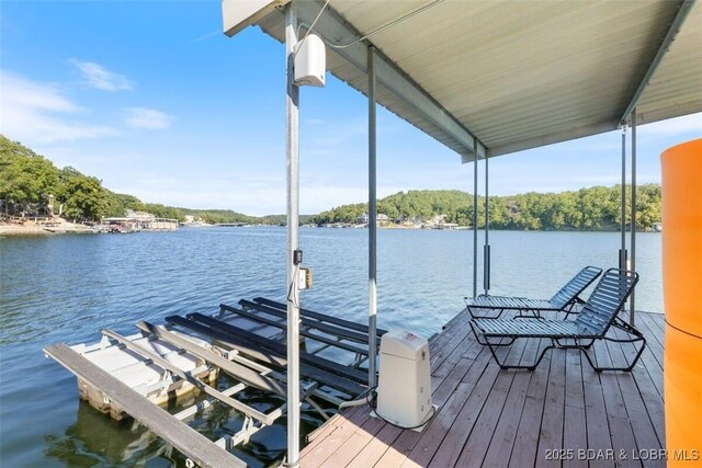 33271 Elaine Rd, Sunrise Beach, MO 65079 - dock featuring boat lift and a water view