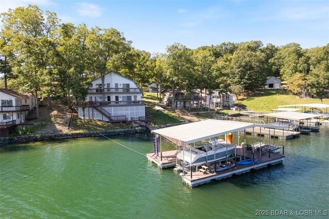 33271 Elaine Rd, Sunrise Beach, MO 65079 - dock area featuring a water view and boat lift