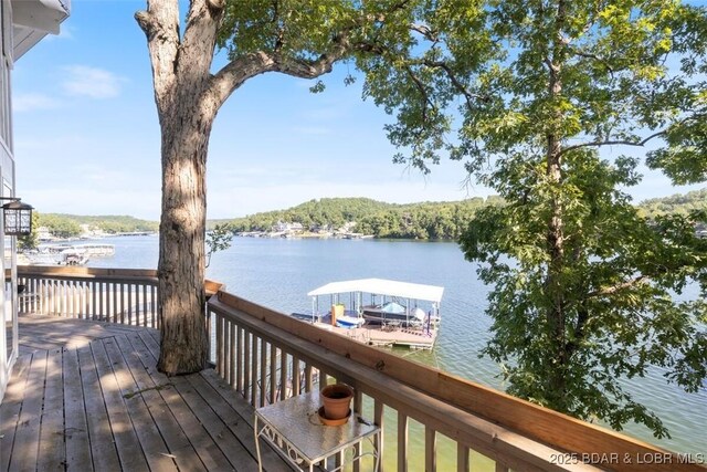 33271 Elaine Rd, Sunrise Beach, MO 65079 - wooden terrace featuring a water view