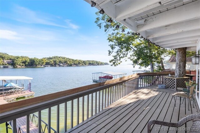 33271 Elaine Rd, Sunrise Beach, MO 65079 - wooden terrace with a water view