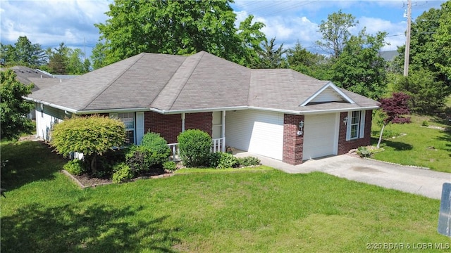 ranch-style house featuring concrete driveway, brick siding, an attached garage, and a front lawn