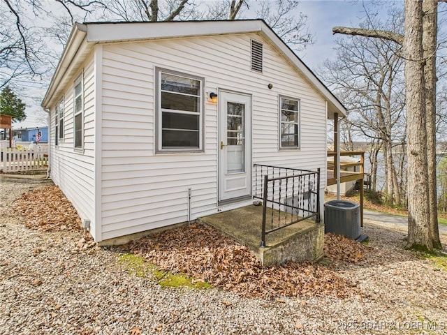 1052 Diggs Rd, Osage Beach, MO 65065 - view of front facade with cooling unit and fence