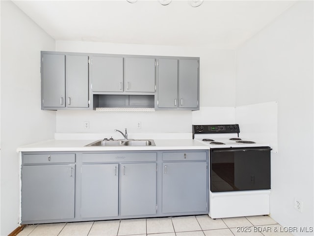 1052 Diggs Rd, Osage Beach, MO 65065 - kitchen with range with electric cooktop, gray cabinetry, a sink, and light countertops