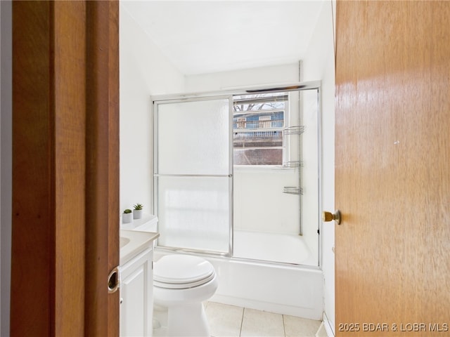 1052 Diggs Rd, Osage Beach, MO 65065 - bathroom with toilet, tile patterned flooring, vanity, and enclosed tub / shower combo
