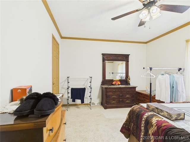bedroom with a ceiling fan, carpet floors, and crown molding