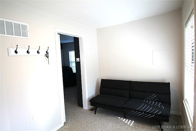 sitting room with baseboards, carpet, and visible vents